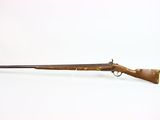 an old rifle with a wooden handle on a white background