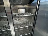 an open refrigerator with a lot of food inside of it