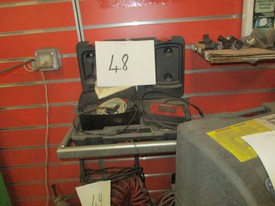 a small stove with a sign on it in a room
