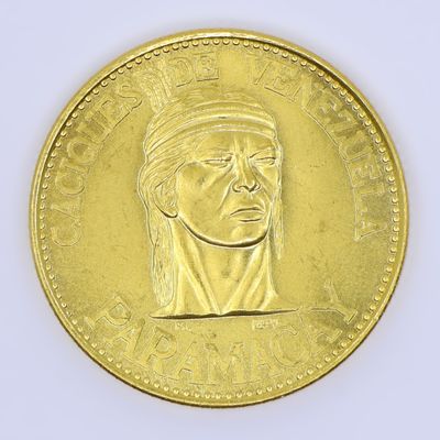 an image of a gold coin with a portrait of a man in a turban