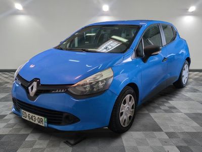 the blue car is parked on a checkered floor in a garage