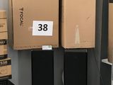 many boxes stacked on top of each other in a room