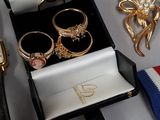 a box with rings and other items on a table