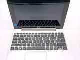 a laptop that is sitting on a white table