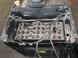 a machine that is sitting on a table in a garage