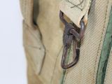a close up of a bag with a metal hook