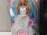 a barbie doll that is in the packaging on the table