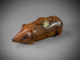 an old wooden animal figurine with a tag on it ' s neck