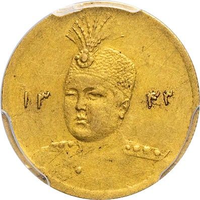 a close up of a gold coin with an image of a man on it