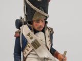 statue of a man in a military uniform holding a rifle