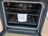 a black oven with a note taped to it ' s door