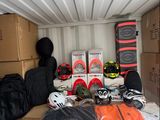 many boxes and helmets in the back of a moving truck
