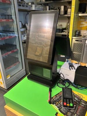 a computer monitor sitting on top of a table in a store