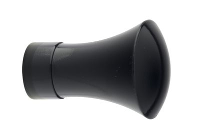 a black speaker that is on a white surface