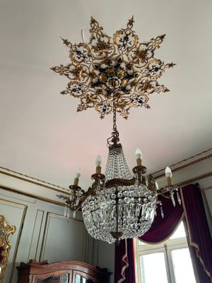a chandelier hanging from the ceiling in a room