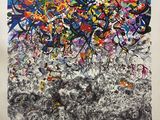 une peinture représentant un mélange de différentes couleurs sur une feuille blanche