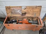 an old tool box with a hammer and other tools in it
