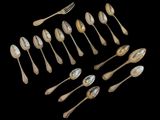 a lot of spoons and spoon spoons on a black background