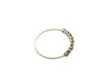 a close up of a ring on a white surface with a white background