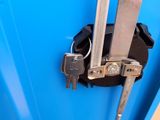 a blue container with a bunch of keys in it