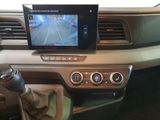 a car dashboard with a monitor and a remote control