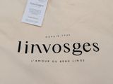 une image représentant un sac blanc muni d'une étiquette