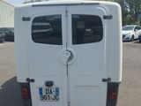 a white van that is parked in a parking lot