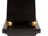 sculpture of a clock on a pedestal on a white background