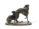statue of a dog and a cat on a marble base