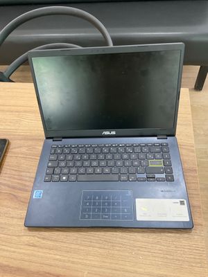 a laptop and a cell phone on a table