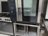 two ovens and a microwave in a kitchen