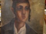 tableau représentant un jeune homme coiffé d'un chapeau, posé sur un chevalet dans une pièce