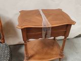 pair of chairs with a table and a chair with a ribbon on it