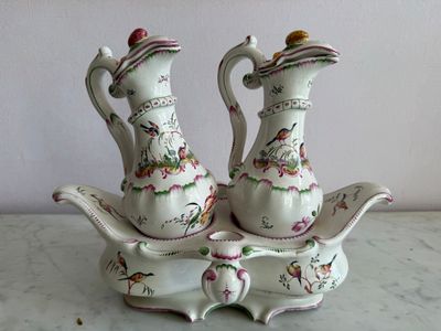 two vases that are sitting on top of a table