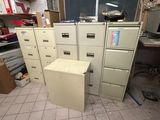 a lot of filing cabinets in a room with a lot of boxes on the floor