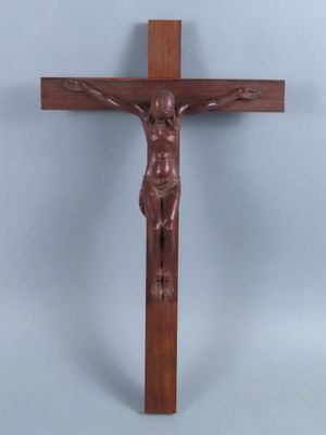 a wooden crucifix with a person on the cross