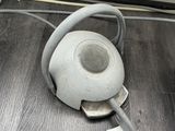 a tea pot that is sitting on the floor next to a computer keyboard