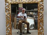 a man that is sitting in front of a mirror