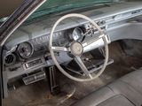 a car dashboard with a steering wheel and a dash board