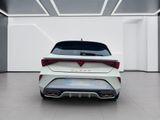 the rear end of a white car in a white room