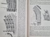 an open book with a drawing of a building inside of it