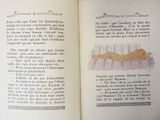 an open book with a drawing of a woman laying on a bed