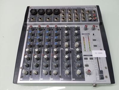a close up of a sound board with many knobs on it