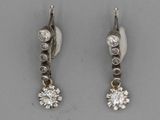 pair of diamond earrings on a white background