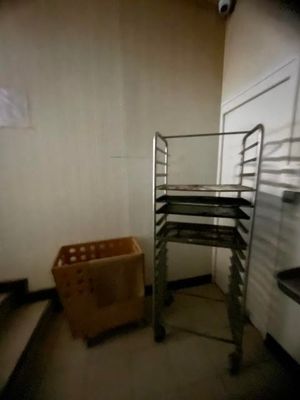 an image of a room with a shelf and a basket
