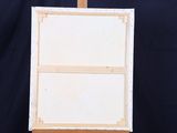 a easel with a painting on it on a black background