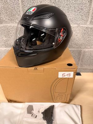 a helmet sitting on top of a box on a table