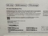 the back of a white laptop with a black and white sticker on it