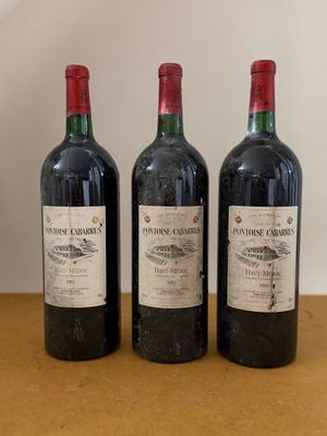 three bottles of wine sitting on top of a table next to each other