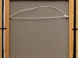 a close up of a picture frame with a string hanging from it